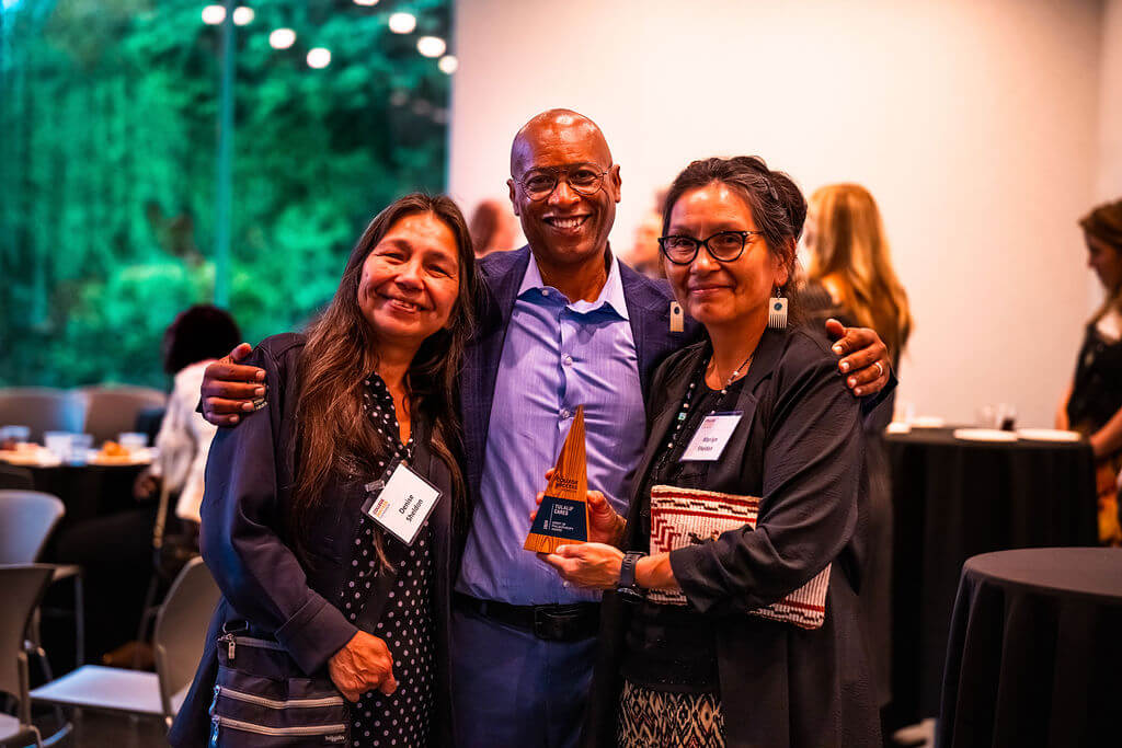 CSF President James Dorsey stands with two representatives from Tulalip Cares